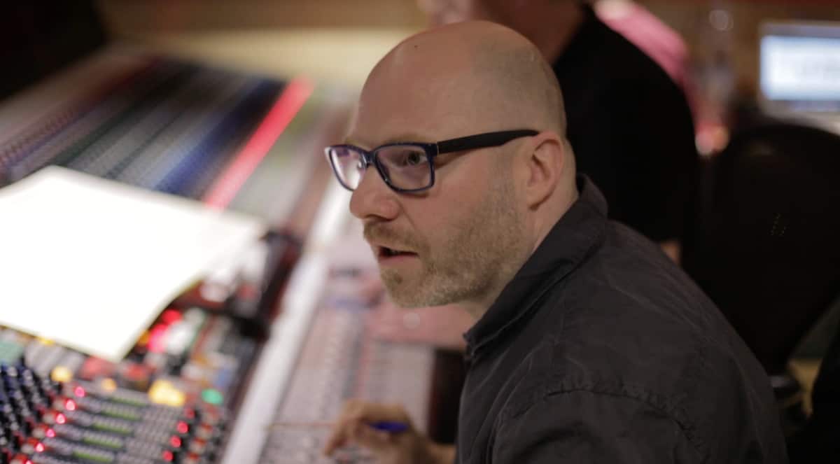 Headshot of Frank Ilfman in front of a mixing board