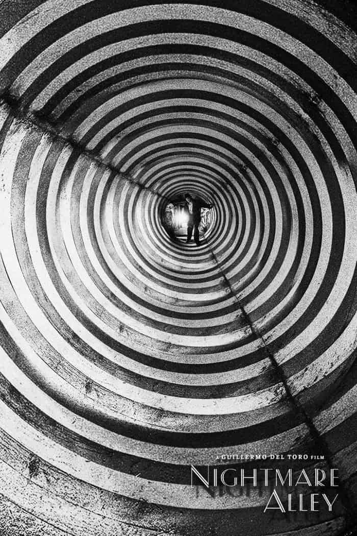 A Man looks into a disorienting circus tunnel