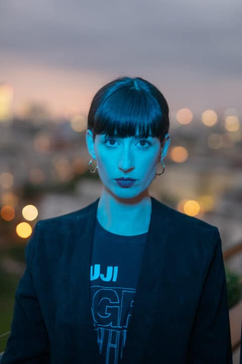 Headshot of Maya Shenfeld, looking seriously, thoughtfully into the camera.